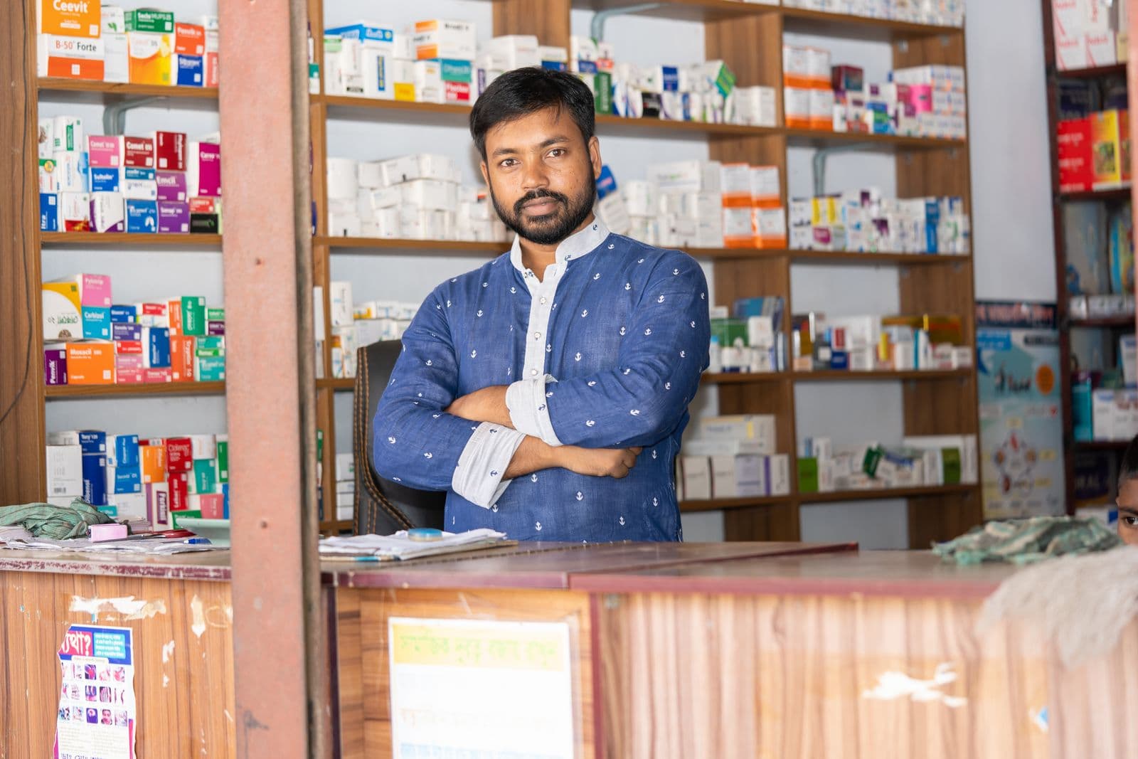 Medical store owner at the pharmacy counter