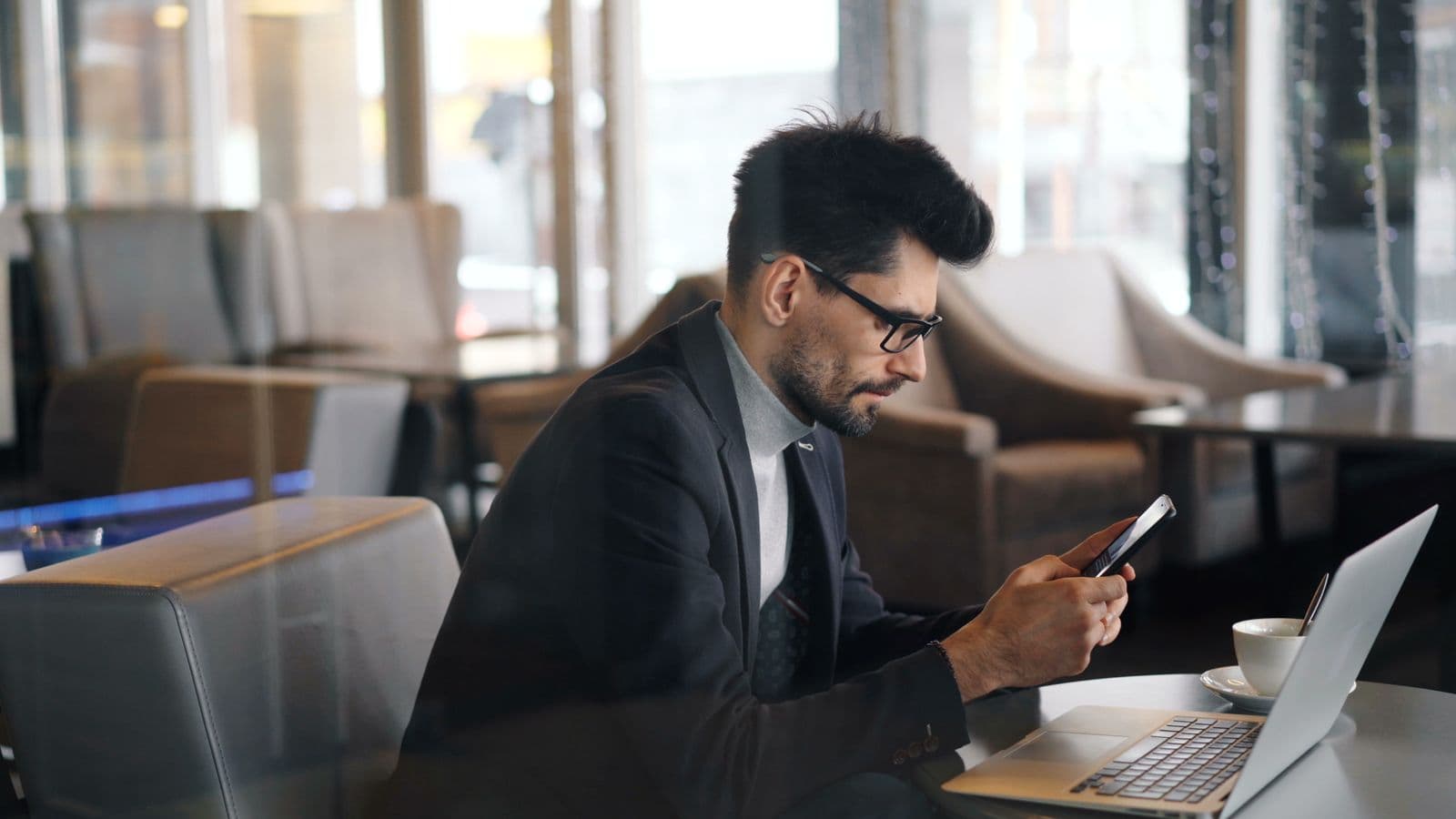Professional messaging a client on a smartphone