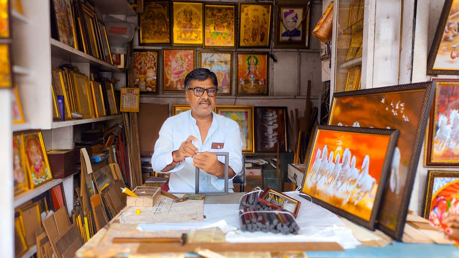 Shop owner receiving a catalogue order on WhatsApp on their phone