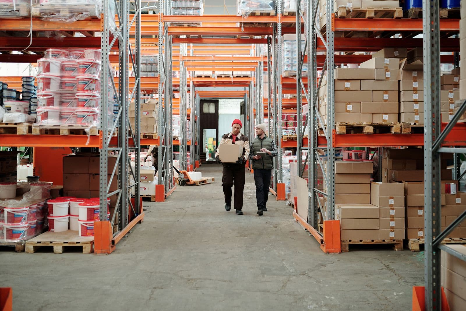 Pharmacy warehouse shelves stocked with medicine boxes