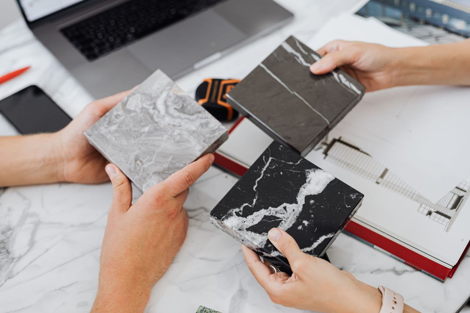 Interior designer reviewing material samples with a client