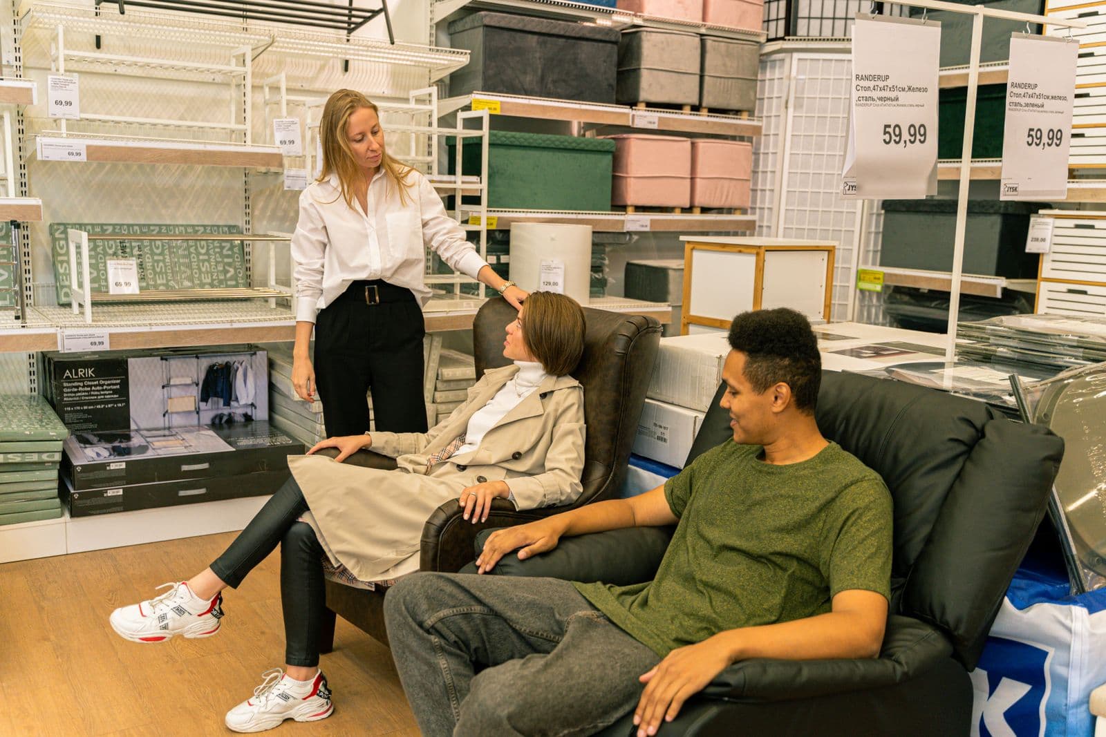 Salesperson helping a customer in a bright electronics store