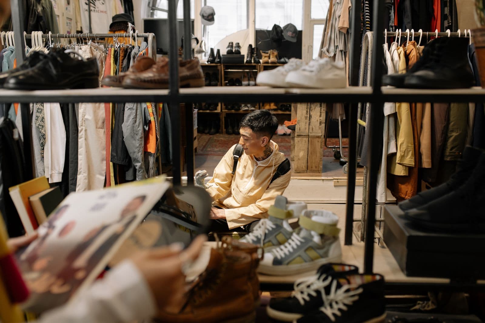 Buyer browsing a footwear and apparel catalogue on a phone