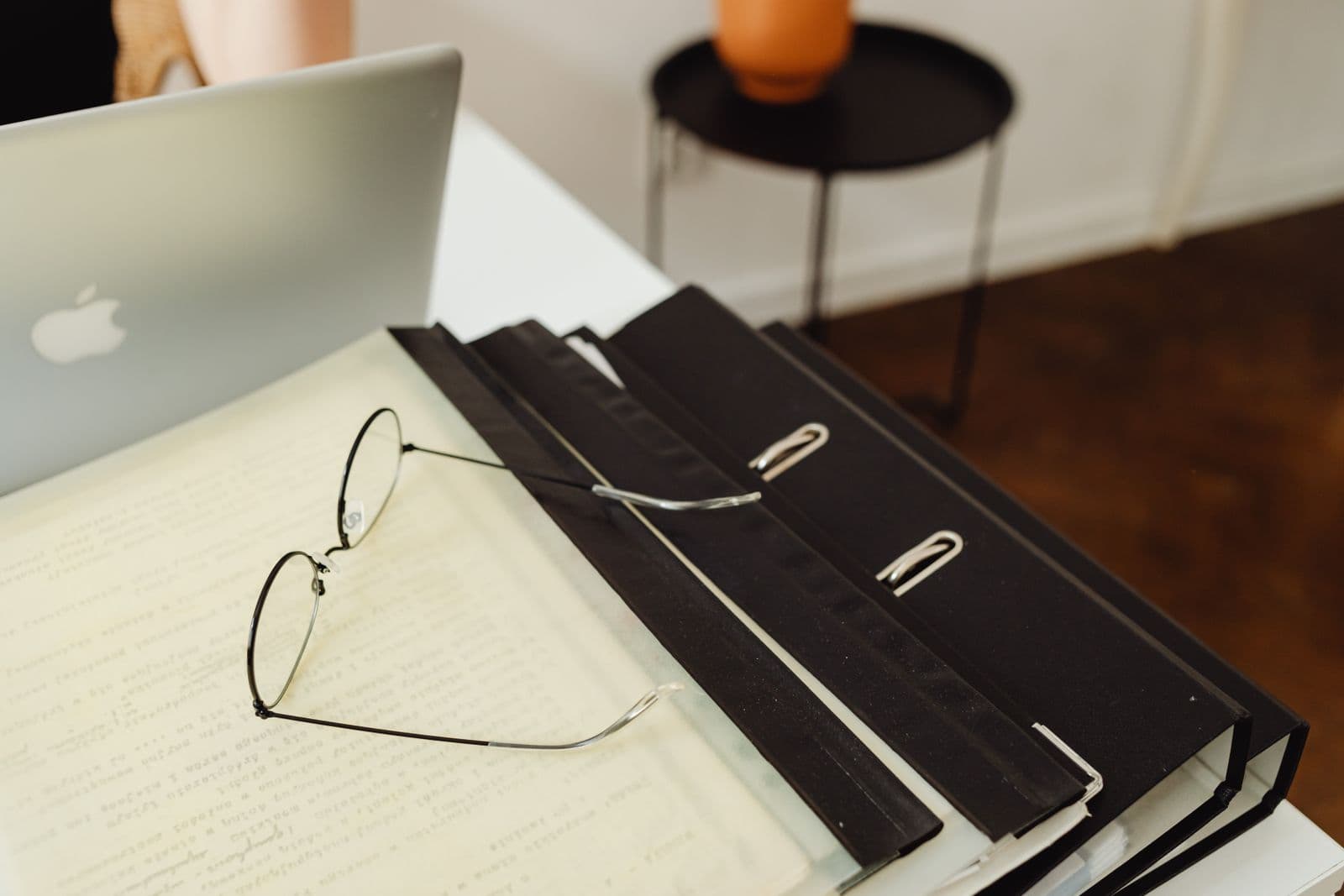 Tidy organised desk with a laptop and neatly filed documents