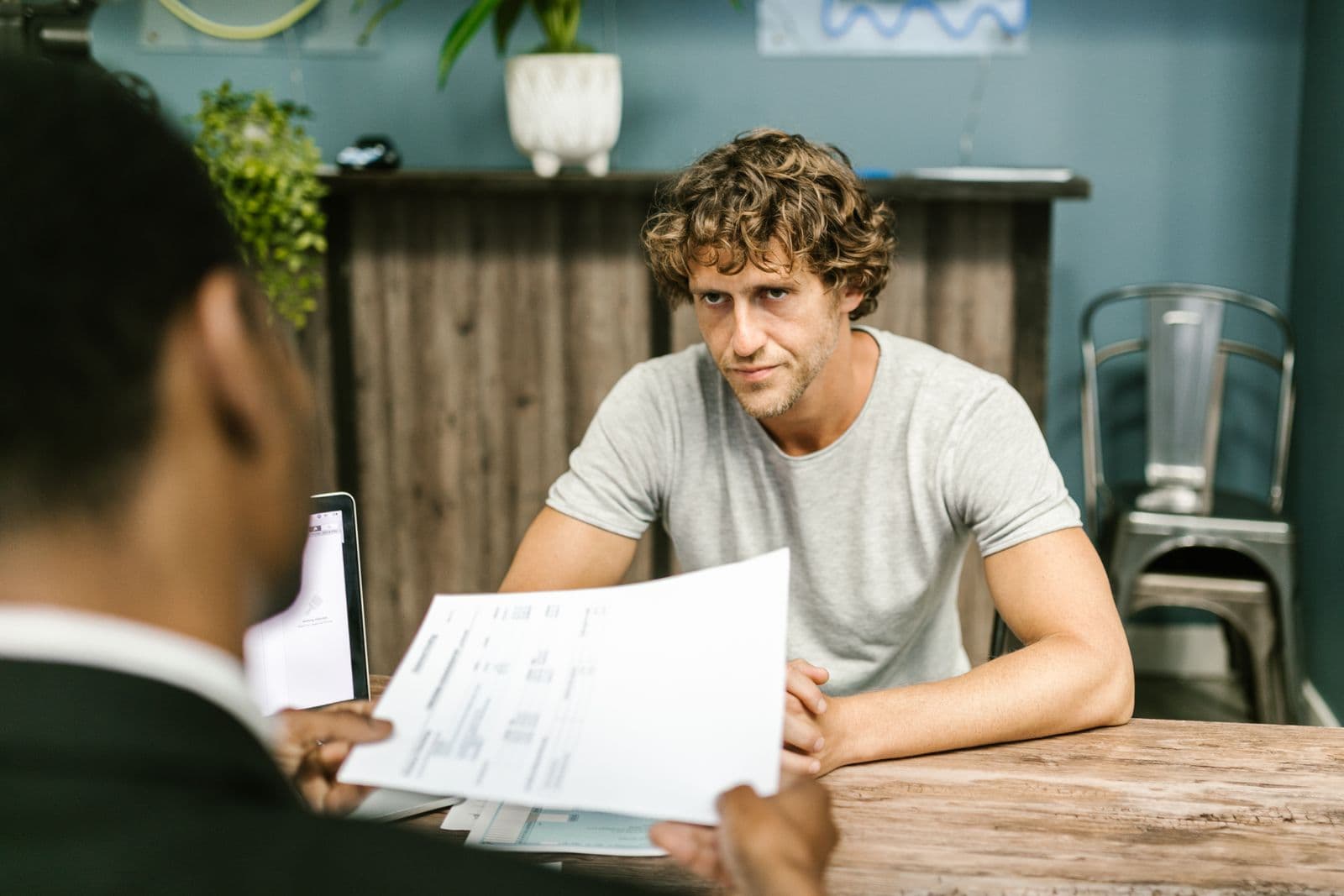 Accountant and consultant meeting a client at a desk