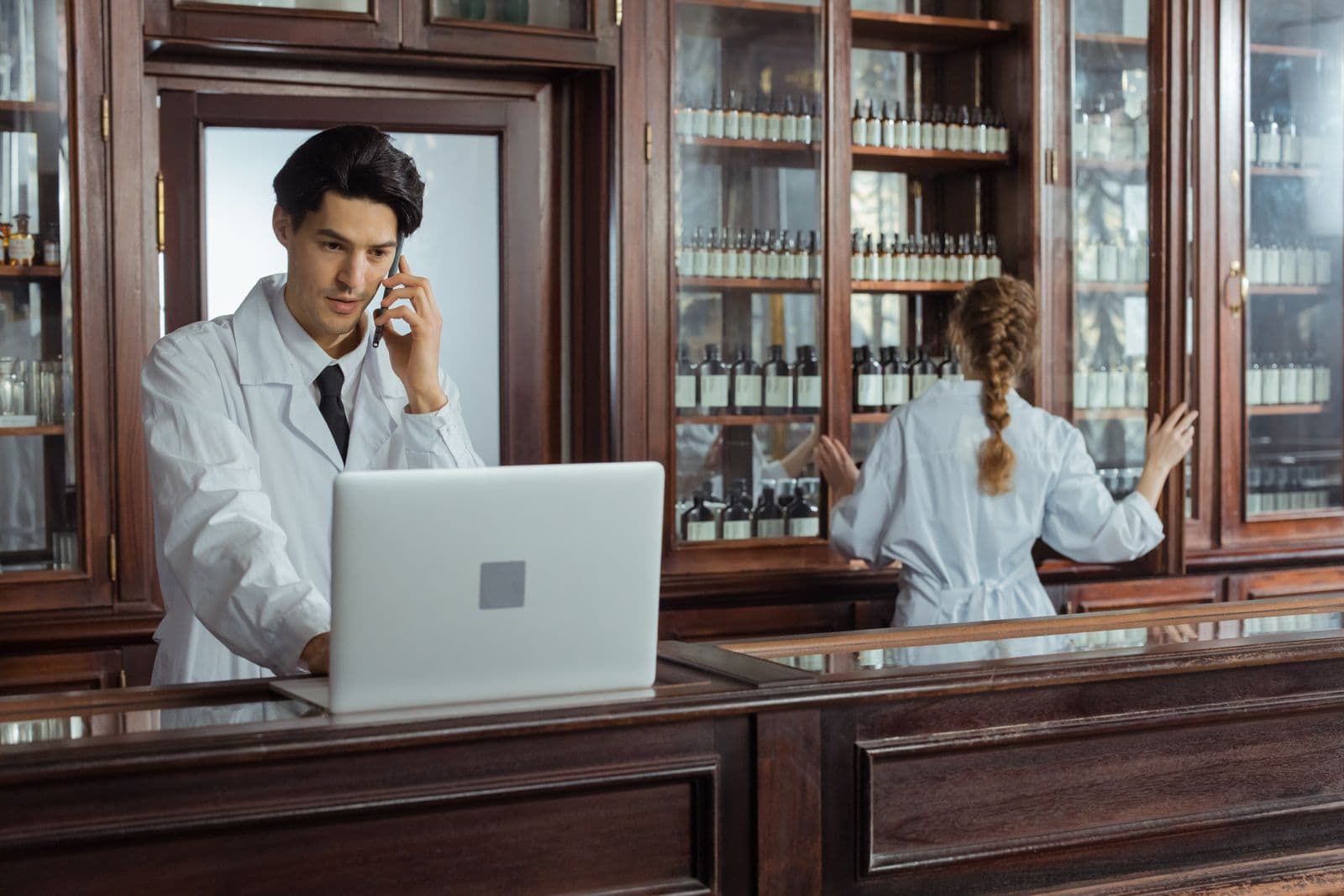 Pharmacist at the counter of a bright modern pharmacy