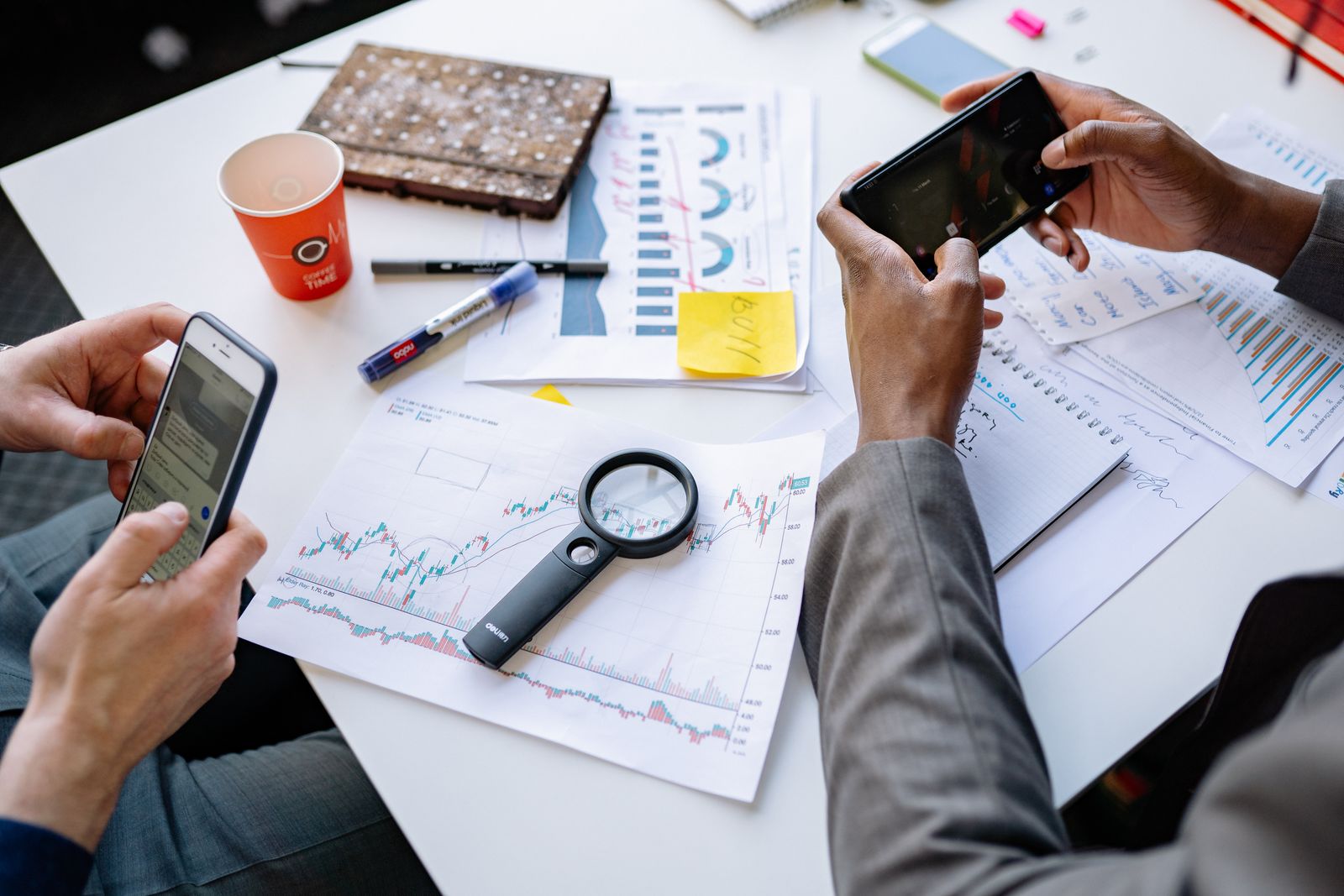 Business team using the app on a smartphone in the office